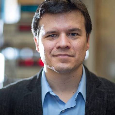 photo of Pablo Jarillo-Herrero in suit jacket in front of lab equipment