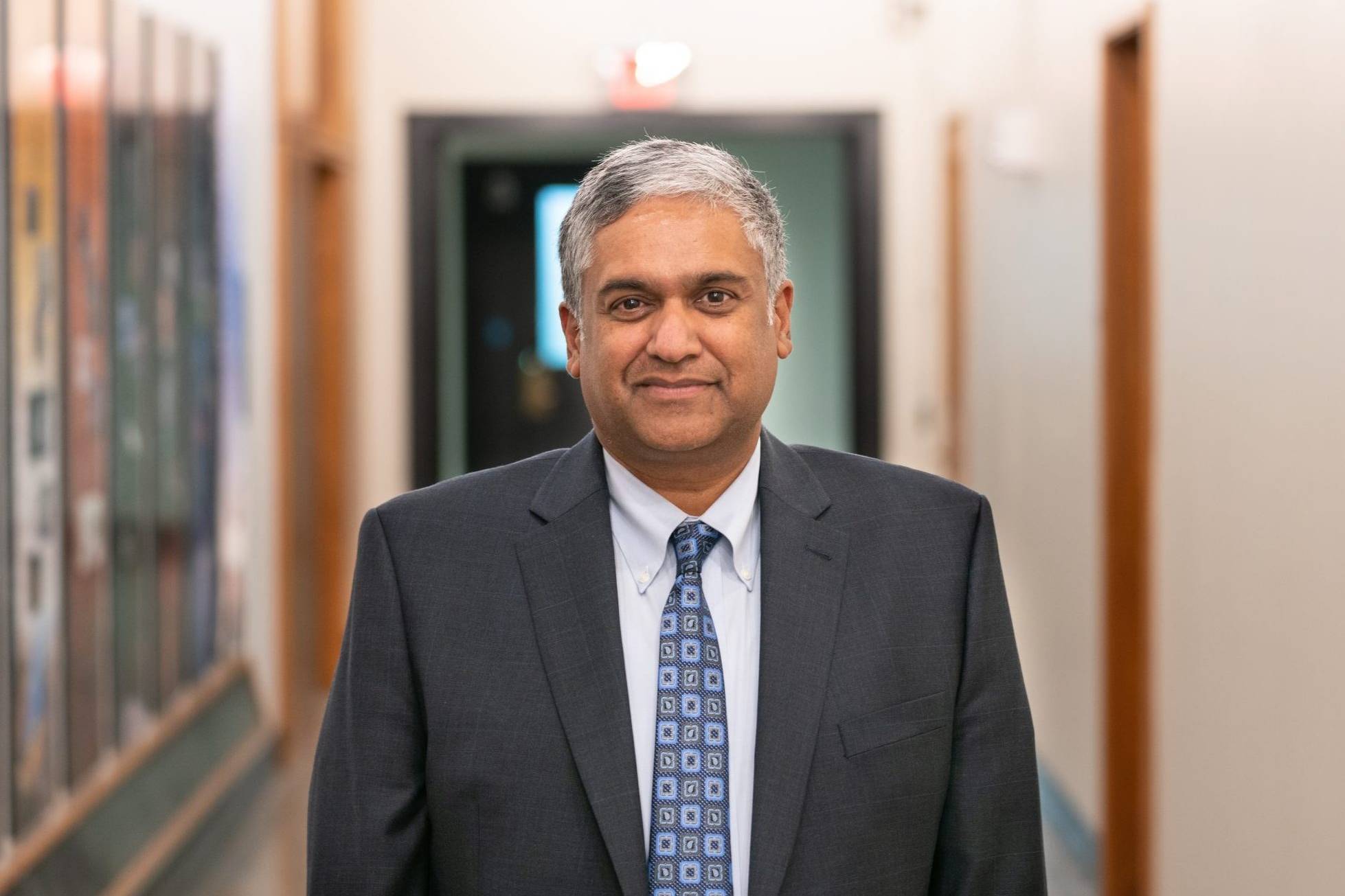 photo of MIT Dean of Engineering Anantha Chandrakasan in hallway