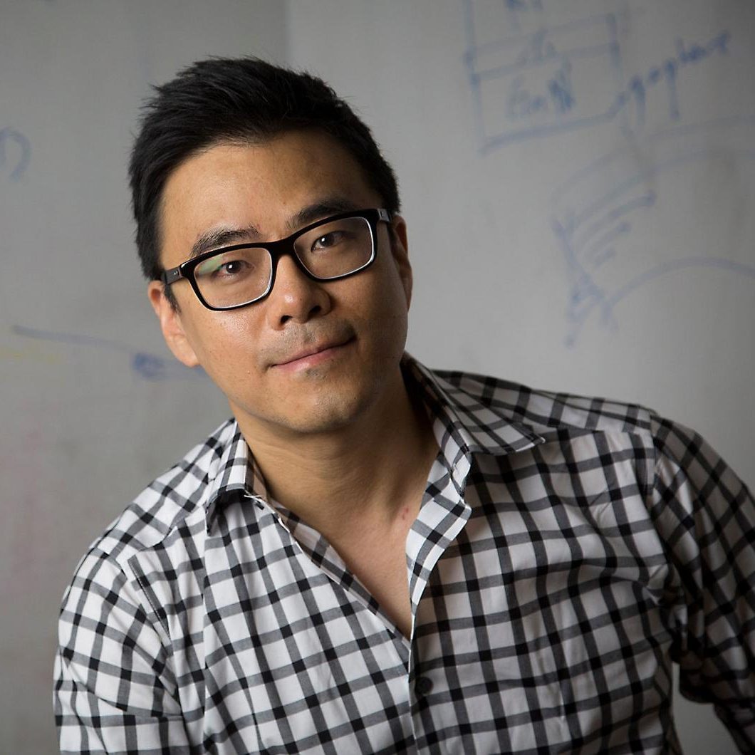 photo of Jeehwan Kim in front of whiteboard with diagrams