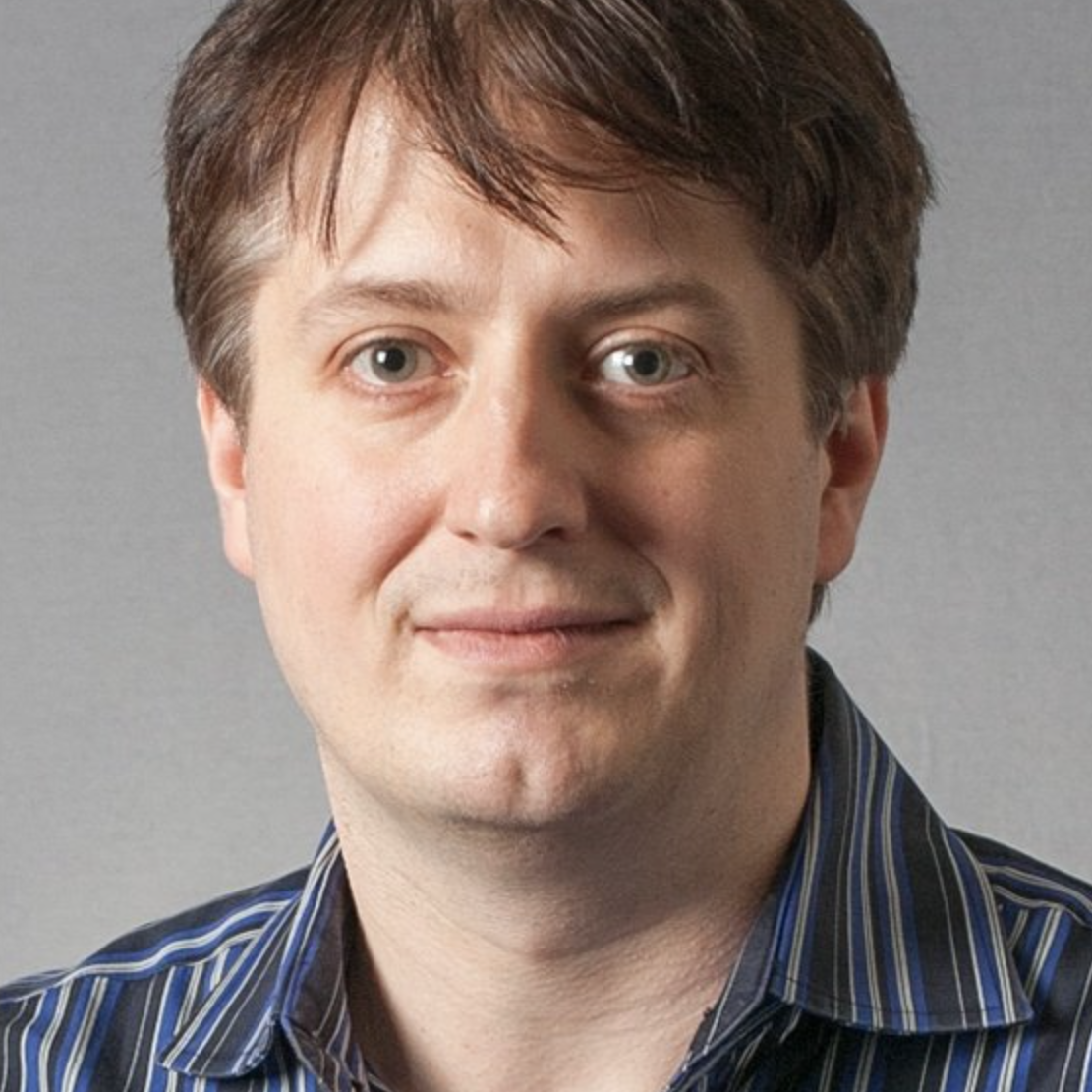 photo of Wojciech Matusik with grey background