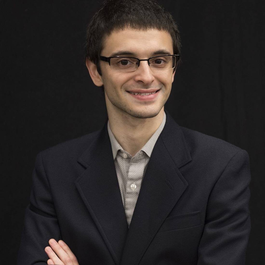 photo of Max Shulaker with dark grey background