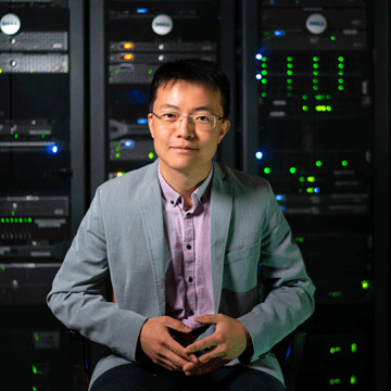 photo of MIT Professor Song Han seated in lab