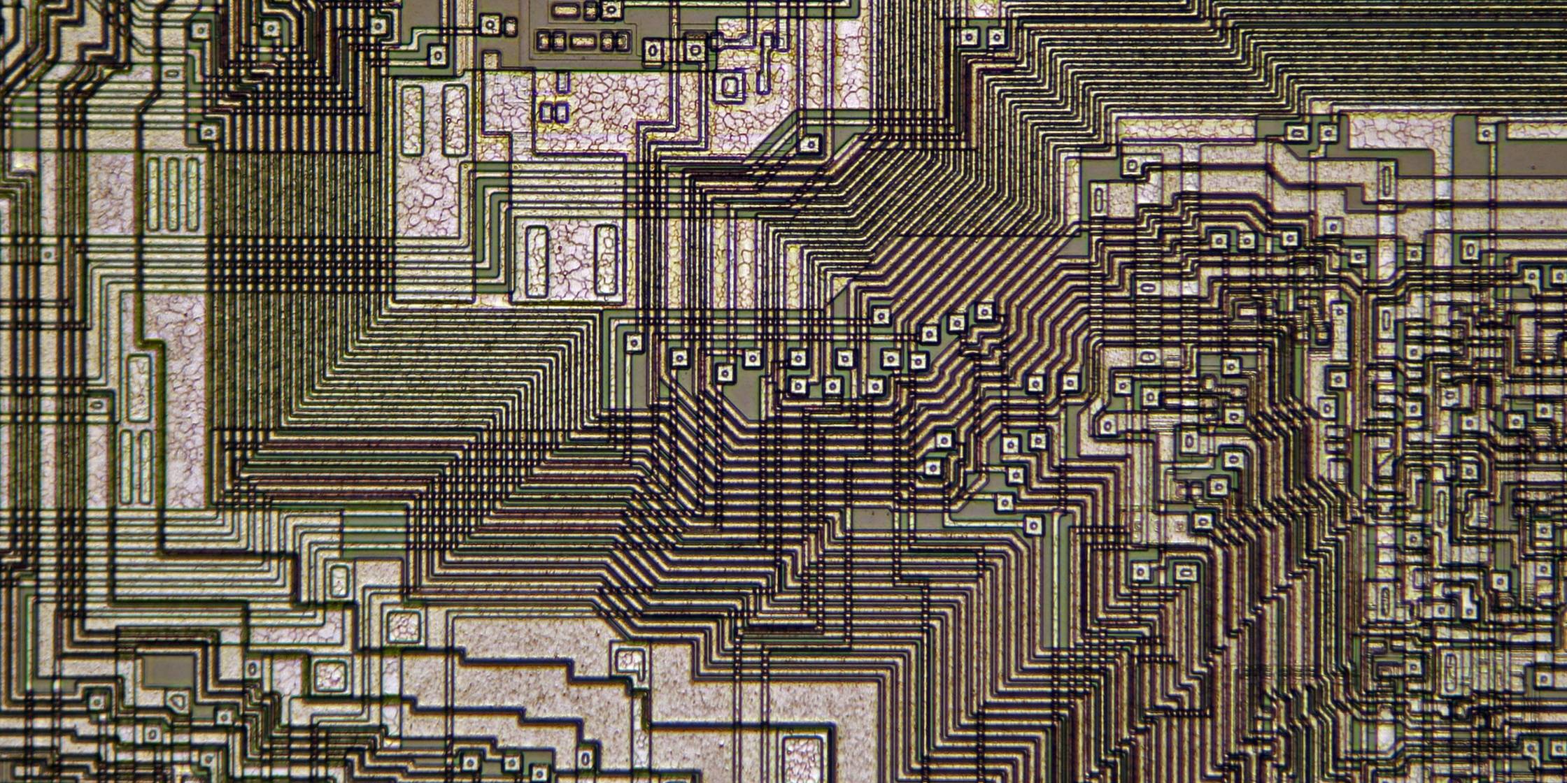 close up of computer chip in shades of green and brown