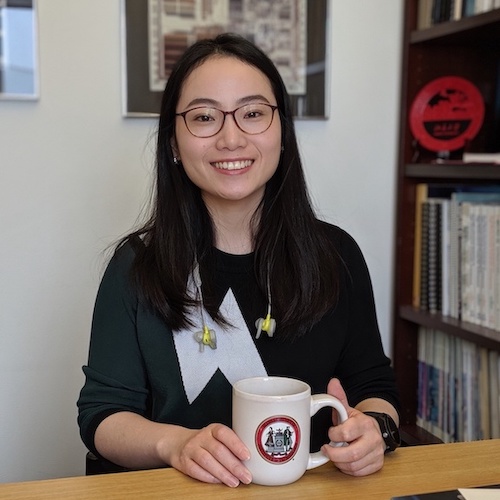 photo of Mengjia Yan seated in her office