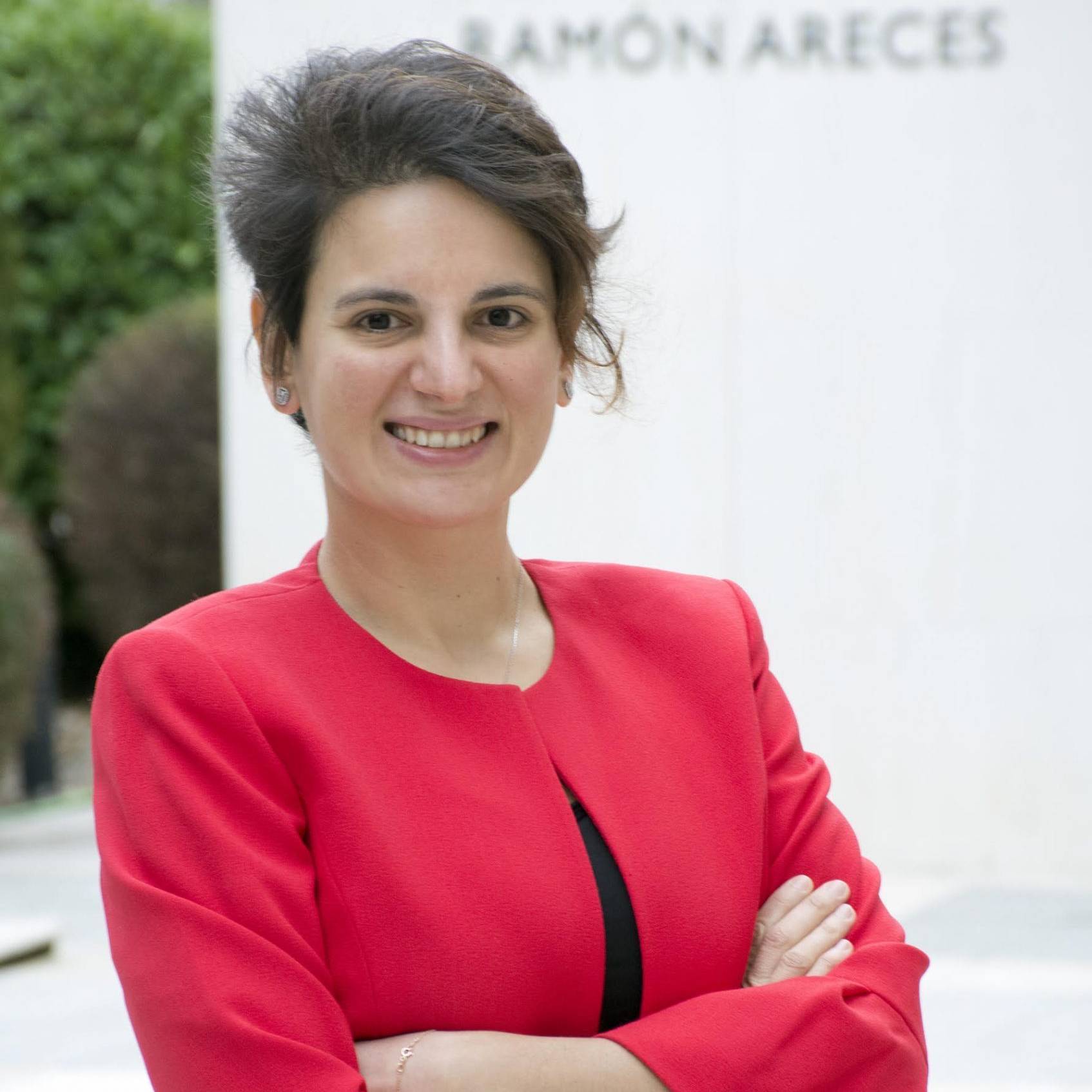 photo of Rabia Yazicigil Kirby in red blazer outside