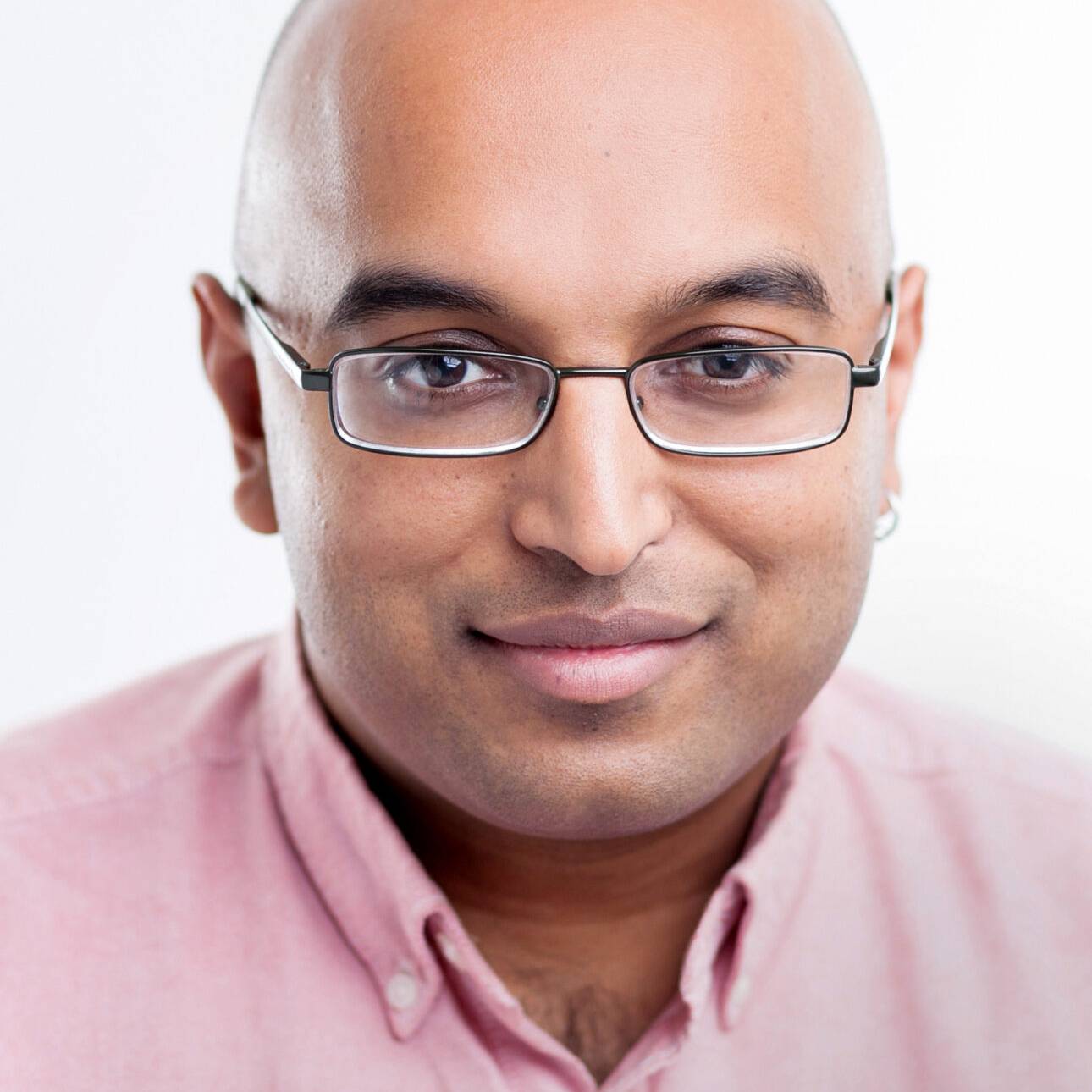 photo of vikash mansinghka seated in front of grey background