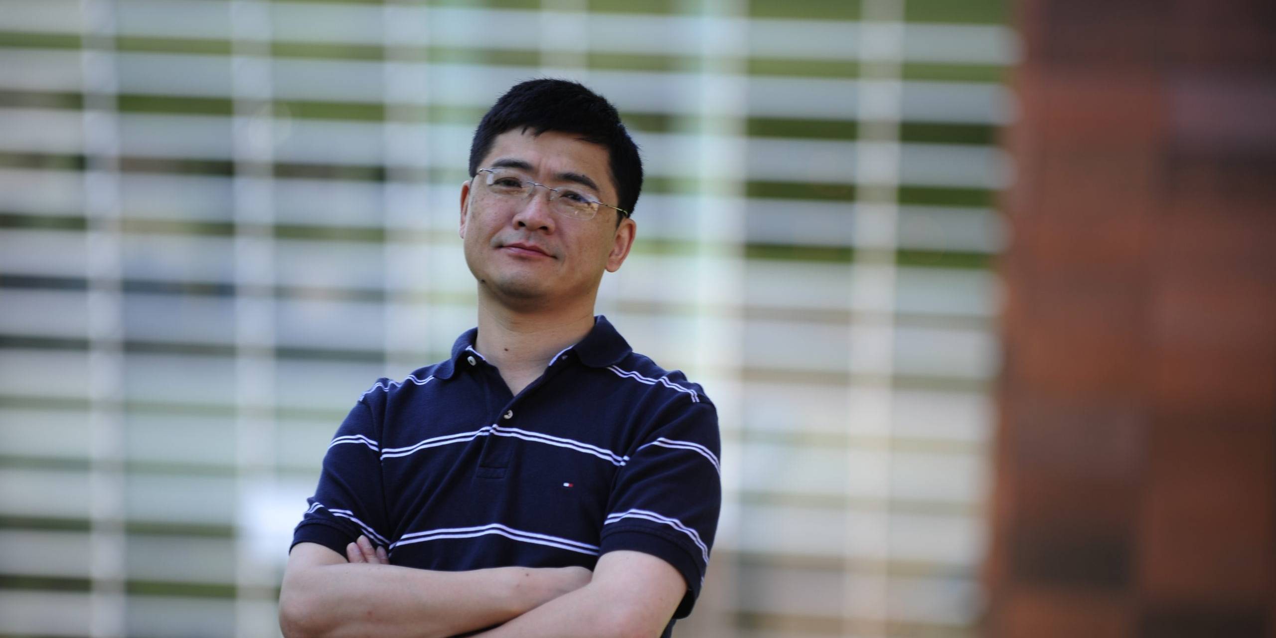 Peide (Peter) Ye standing outside