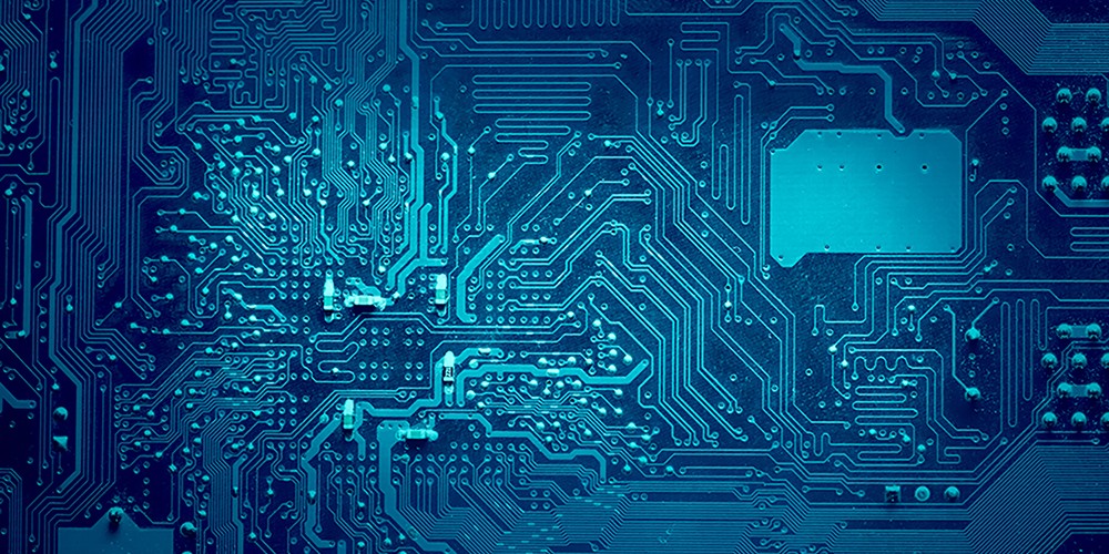 Blue color computer electronic circuits faded to dark blue at the sides.