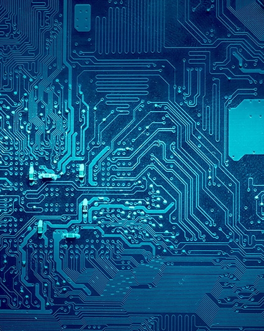 Blue color computer electronic circuits faded to dark blue at the sides.
