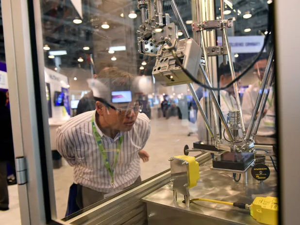 man looking at lab equipment Photo credit: Michael Short/Bloomberg via Getty Images