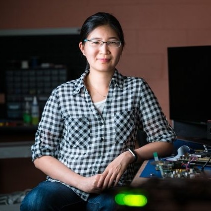 photo of Vivienne Sze standing in her lab