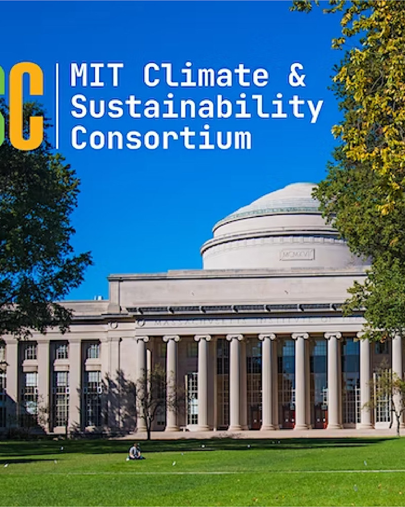 photo of MIT dome building with trees and lawn in front