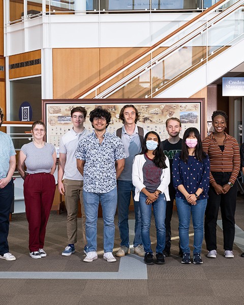 diverse group of students standing in lobby at MIT