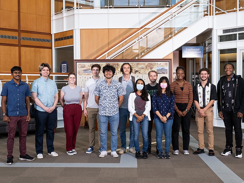 diverse group of students standing in lobby at MIT