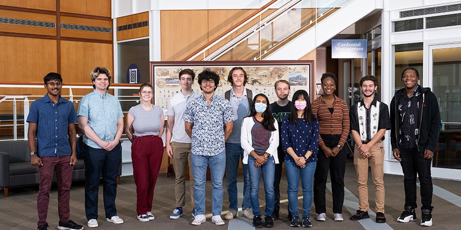 diverse group of students standing in lobby at MIT