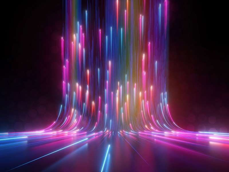 abstract multi color streaks of light sweeping upward to show fast movement