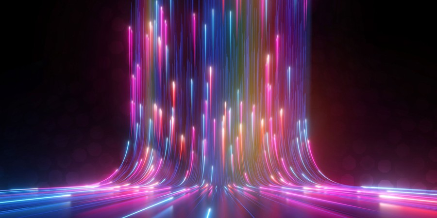 abstract multi color streaks of light sweeping upward to show fast movement