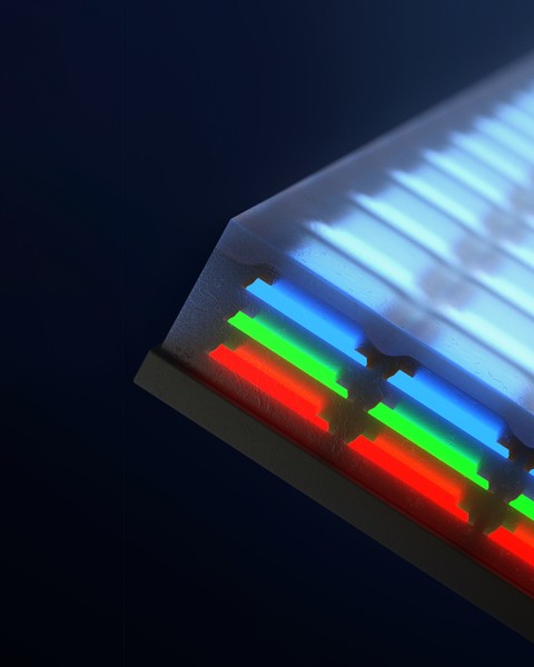 Closeup of a screen has 3 layers of individual LEDs; blue on top, then green and red.