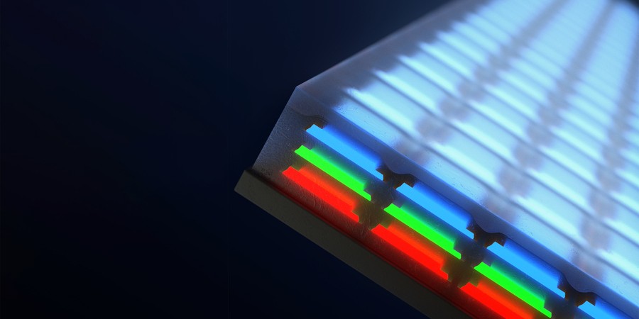Closeup of a screen has 3 layers of individual LEDs; blue on top, then green and red.