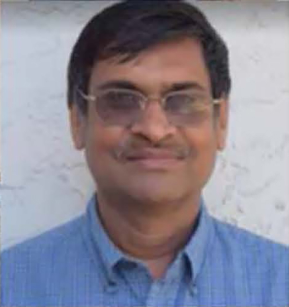 male wearing blue shirt and glasses