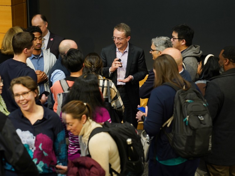 Pat Gelsinger smiles as he is surrounded by people eager to talk to him after the event.