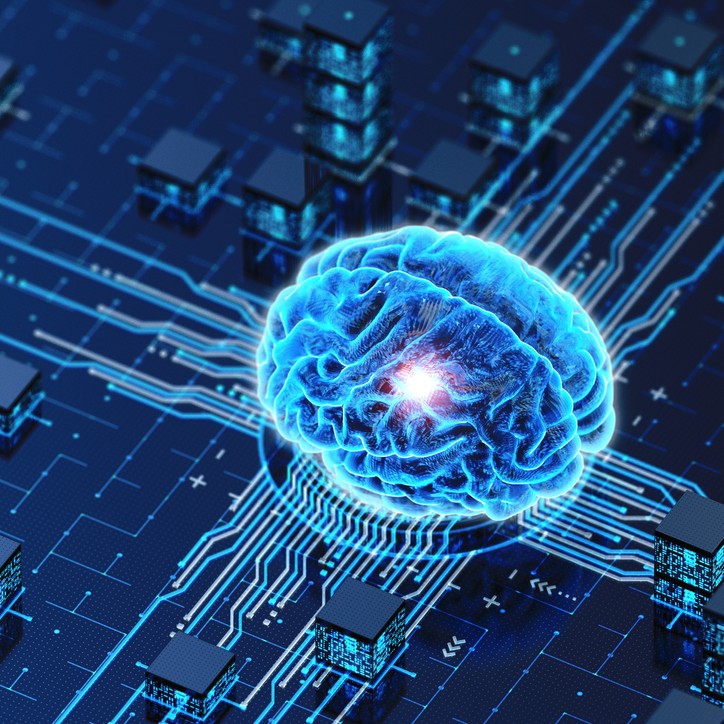 3D brain sitting on computer chip in shades of blue