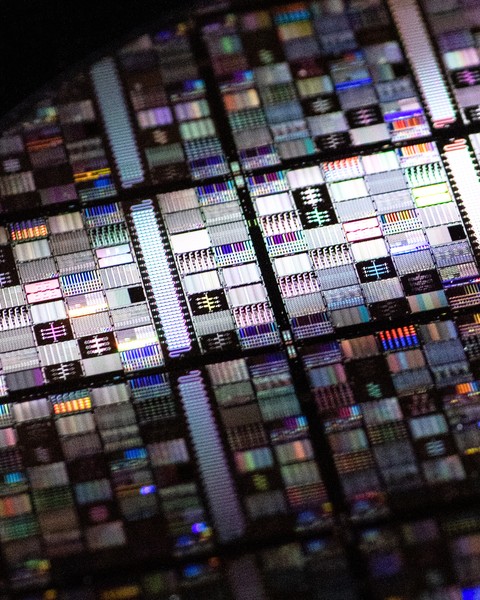 A close-up shot of a superconducting qubit wafer, showing microfabricated circuits