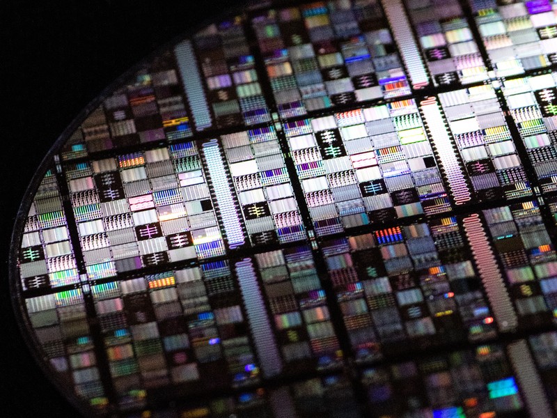 A close-up shot of a superconducting qubit wafer, showing microfabricated circuits