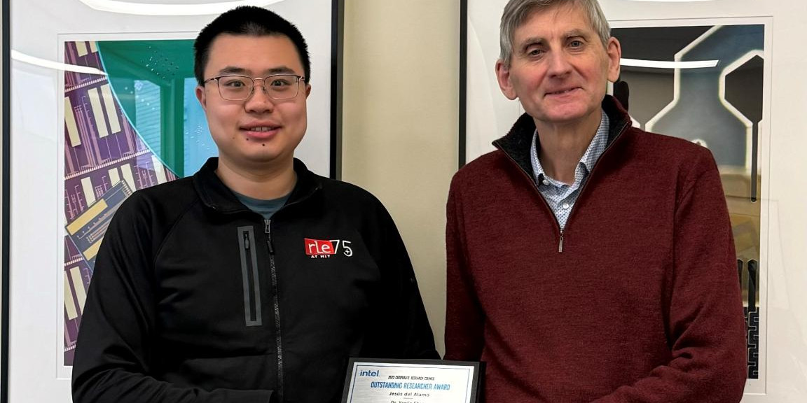 Yanjie Shao and Jesus Del Alamo pose for a photo with their award