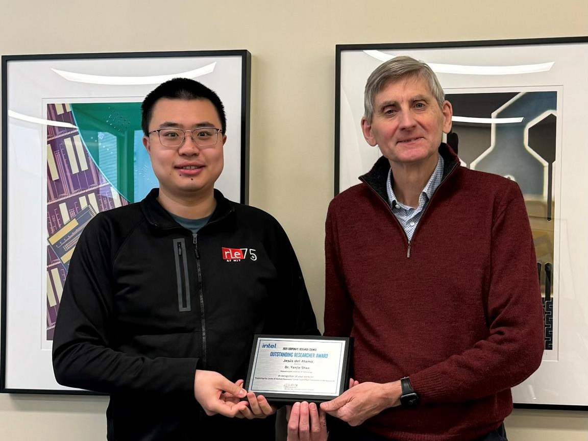 Yanjie Shao and Jesus Del Alamo pose for a photo with their award
