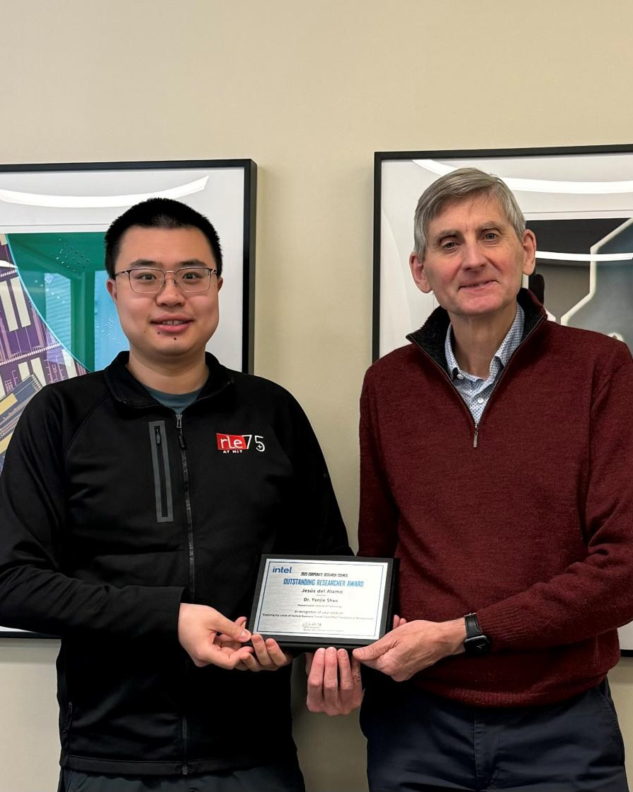 Yanjie Shao and Jesus Del Alamo pose for a photo with their award