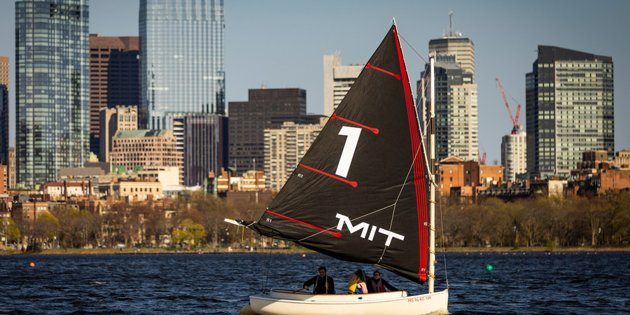 An MIT Sailboat bearing the number 1 on its sail on the Charles River