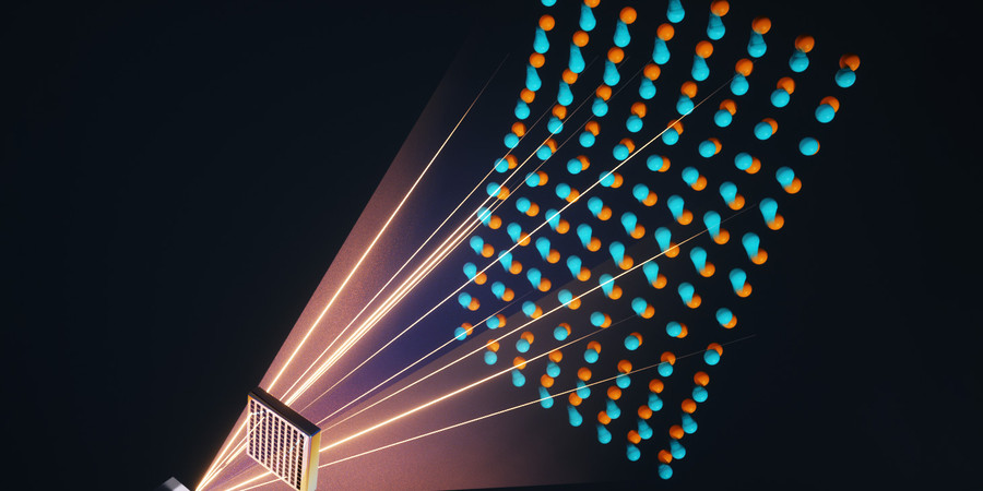 Graphic showing light emanating from a cubic crystal and passing through a material with an array of square holes. A lattice of atoms appears on the other side