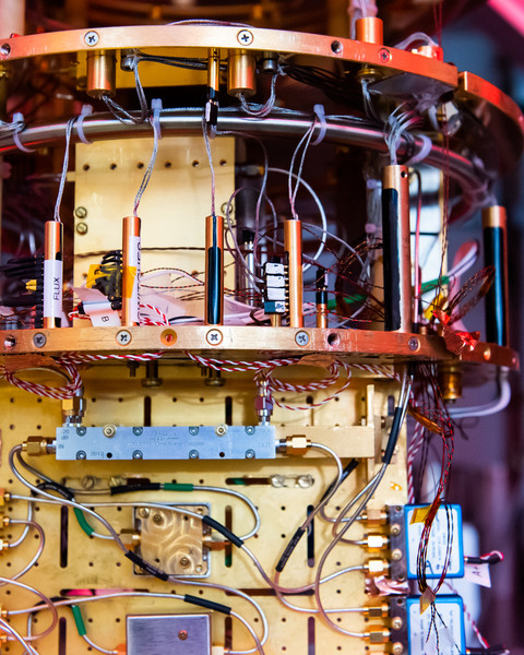 The colorful assemblage of cables and circuits that make up a quantum computer are shown in close detail.
