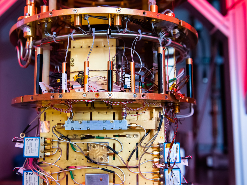 The colorful assemblage of cables and circuits that make up a quantum computer are shown in close detail.