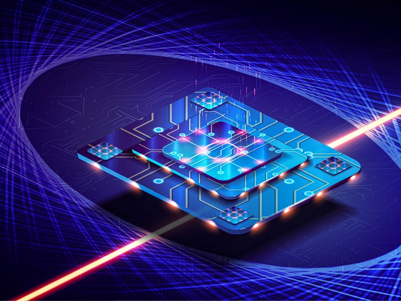 Futuristic computer chip shot through by a laser