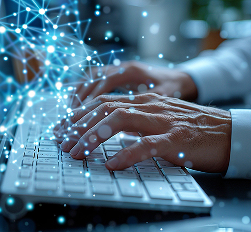 image of hands typing on a computer keyboard with abstract blue neural network overlay