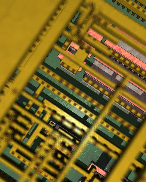 Very close-up photo of a computer chip, with mostly green and yellow components