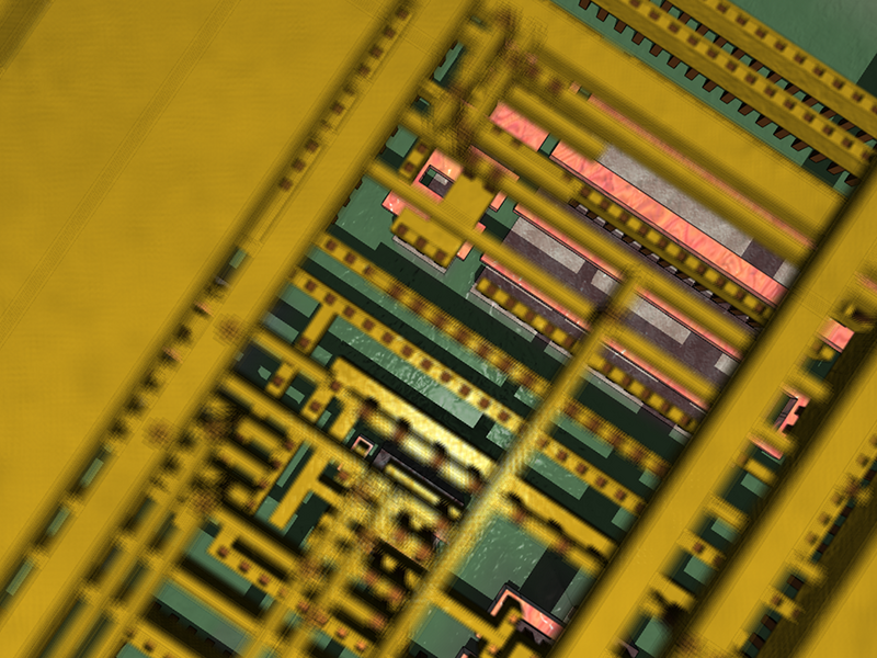 Very close-up photo of a computer chip, with mostly green and yellow components