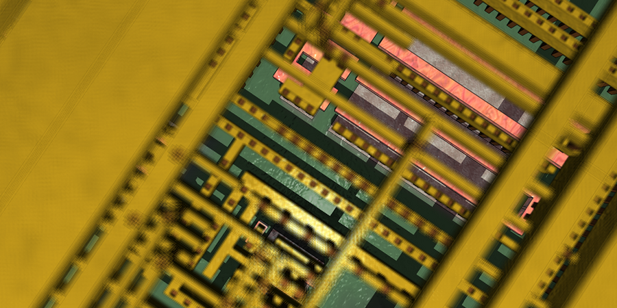 Very close-up photo of a computer chip, with mostly green and yellow components